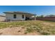 The house features solar panels on the roof, and a spacious backyard with a covered patio at 37008 N Hinterwald Way, San Tan Valley, AZ 85143