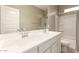 Bathroom with a dual sink vanity, large mirror, and a shower-tub combo at 37008 N Hinterwald Way, San Tan Valley, AZ 85143