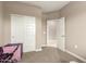 Bedroom with carpet, a sliding closet door, and an adjacent doorway leading to another room at 37008 N Hinterwald Way, San Tan Valley, AZ 85143