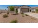 Charming single-Gathering home featuring a two-car garage and a low maintenance desert landscaped front yard at 37008 N Hinterwald Way, San Tan Valley, AZ 85143