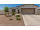 Charming single-Gathering home featuring a two-car garage and a low maintenance desert landscaped front yard at 37008 N Hinterwald Way, San Tan Valley, AZ 85143