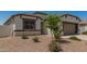 Charming single-Gathering home featuring a two-car garage and a low maintenance desert landscaped front yard at 37008 N Hinterwald Way, San Tan Valley, AZ 85143