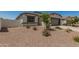 Charming single-Gathering home featuring a two-car garage and a low maintenance desert landscaped front yard at 37008 N Hinterwald Way, San Tan Valley, AZ 85143