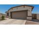 Charming single-Gathering home featuring a two-car garage and a low maintenance desert landscaped front yard at 37008 N Hinterwald Way, San Tan Valley, AZ 85143