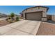 Charming single-Gathering home featuring a two-car garage and a low maintenance desert landscaped front yard at 37008 N Hinterwald Way, San Tan Valley, AZ 85143