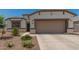 Charming single-Gathering home featuring a two-car garage and a low maintenance desert landscaped front yard at 37008 N Hinterwald Way, San Tan Valley, AZ 85143