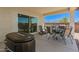 Covered patio with outdoor seating, hot tub, and view of the backyard at 37008 N Hinterwald Way, San Tan Valley, AZ 85143