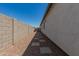 The side yard features desert landscaping with stone pavers, creating a low-maintenance and attractive outdoor space at 37008 N Hinterwald Way, San Tan Valley, AZ 85143