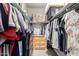 Spacious walk-in closet with ample hanging space and built-in drawers for organization and storage at 37008 N Hinterwald Way, San Tan Valley, AZ 85143