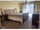 Cozy bedroom with plush carpeting and sliding glass doors to outdoor patio at 4107 E Bloomfield Rd, Phoenix, AZ 85032