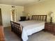 Bedroom with neutral carpet and sliding glass door with a dresser, nightstand and lamps at 4107 E Bloomfield Rd, Phoenix, AZ 85032