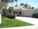 Charming single-story home with a well-manicured lawn and attached two-car garage at 4107 E Bloomfield Rd, Phoenix, AZ 85032