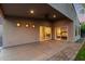 Covered back patio with sliding glass doors and recessed lighting at dusk at 4205 N 19Th Pl, Phoenix, AZ 85016