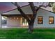 Backyard featuring covered patio, well-kept lawn, and mature shade tree at 4205 N 19Th Pl, Phoenix, AZ 85016