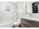 Stylish bathroom featuring subway tile, modern fixtures, and sleek vanity at 4205 N 19Th Pl, Phoenix, AZ 85016