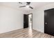 Neutral bedroom with laminate flooring, ceiling fan and matte black doors at 4205 N 19Th Pl, Phoenix, AZ 85016