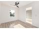 Bright bedroom with light-toned wood flooring, a ceiling fan, and a window offering natural light at 4205 N 19Th Pl, Phoenix, AZ 85016