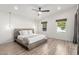 Bright bedroom with platform bed, ceiling fan, and natural light from two windows at 4205 N 19Th Pl, Phoenix, AZ 85016