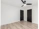 Bright bedroom with laminate flooring, ceiling fan and matte black doors at 4205 N 19Th Pl, Phoenix, AZ 85016