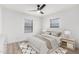 Bright bedroom features neutral decor, a ceiling fan, and wood-look floors at 4205 N 19Th Pl, Phoenix, AZ 85016
