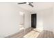 Bedroom featuring light wood-look flooring, fresh white walls, a closet and a contemporary ceiling fan at 4205 N 19Th Pl, Phoenix, AZ 85016