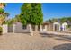 Home with desert landscaping, modern front door, detached garage, and lush green tree at 4205 N 19Th Pl, Phoenix, AZ 85016