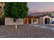 Attractive home with desert landscaping, modern front door, and a detached garage at 4205 N 19Th Pl, Phoenix, AZ 85016