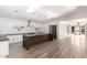 Bright open kitchen featuring a large island, modern lighting, stainless appliances, and light wood floors at 4205 N 19Th Pl, Phoenix, AZ 85016