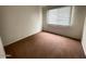 Bedroom with a large window providing ample natural light at 4714 E Pueblo Ave, Phoenix, AZ 85040