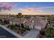 Stunning aerial view of a single-story home with desert landscaping, an attached garage, and a tiled roof at 5122 S Miller Pl, Chandler, AZ 85249
