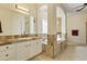 Elegant bathroom with a tub, dual sinks, granite countertops, and neutral colors at 5122 S Miller Pl, Chandler, AZ 85249