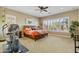 Comfortable bedroom with a wooden bed, shutters, and an exercise machine at 5122 S Miller Pl, Chandler, AZ 85249