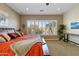 Comfortable bedroom with a large window and shutters bringing in lots of natural light at 5122 S Miller Pl, Chandler, AZ 85249
