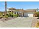 Beautiful home exterior with well-maintained landscaping and a three-car garage at 5122 S Miller Pl, Chandler, AZ 85249