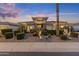 Charming single-story home featuring stone accents, desert landscaping, and warm exterior lighting at 5122 S Miller Pl, Chandler, AZ 85249