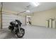 Finished garage with motorcycle, epoxy flooring and a lot of storage at 5122 S Miller Pl, Chandler, AZ 85249