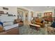 Comfortable living room with leather sofas, area rug, and ample natural light at 5122 S Miller Pl, Chandler, AZ 85249