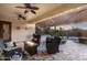 Inviting outdoor living space with comfortable seating and lush landscaping with a fire pit at 5122 S Miller Pl, Chandler, AZ 85249