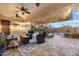 Covered patio with comfortable seating and view of the beautifully landscaped backyard with pool at 5122 S Miller Pl, Chandler, AZ 85249