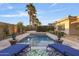 Relaxing poolside view featuring comfortable lounge chairs, lush greenery, and serene palms at 5122 S Miller Pl, Chandler, AZ 85249