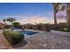 Inviting pool featuring desert landscaping, stone patio, and serene ambiance at 5122 S Miller Pl, Chandler, AZ 85249