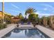 Sparkling swimming pool surrounded by lush landscaping and outdoor lounge furniture at 5122 S Miller Pl, Chandler, AZ 85249