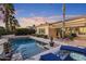 A sparkling swimming pool with lush landscaping and lounge furniture at 5122 S Miller Pl, Chandler, AZ 85249