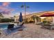 An inviting backyard with a pool, patio area, and outdoor dining space at 5122 S Miller Pl, Chandler, AZ 85249