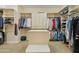 Spacious walk-in closet with shelving, storage, and an organizing island at 5122 S Miller Pl, Chandler, AZ 85249