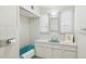 Bathroom features a turquoise bathtub and neutral vanity at 541 W Vernon Ave, Phoenix, AZ 85003