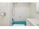 Bathroom showcasing a turquoise tub and tiled shower at 541 W Vernon Ave, Phoenix, AZ 85003