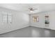A bright bedroom features a ceiling fan and natural light from two windows at 541 W Vernon Ave, Phoenix, AZ 85003