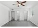 Open view of bedroom with closets, ceiling fan, and bright natural light at 541 W Vernon Ave, Phoenix, AZ 85003