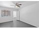 Bedroom features a ceiling fan and large window for natural light at 541 W Vernon Ave, Phoenix, AZ 85003